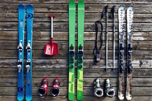 Winter sports gear sitting on a deck